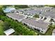 An aerial view displays modern townhomes, a pond, and green spaces, showing the community's layout at 2155 Cerulean Sky Dr, Lutz, FL 33558