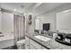 Modern bathroom featuring granite countertops, and a shower and bath combination at 2155 Cerulean Sky Dr, Lutz, FL 33558
