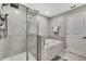 Modern bathroom featuring tiled shower and separate soaking tub at 2155 Cerulean Sky Dr, Lutz, FL 33558