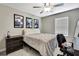 Comfortable bedroom featuring lots of natural light and a ceiling fan at 2155 Cerulean Sky Dr, Lutz, FL 33558