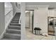 View of entryway with staircase and access to the kitchen at 2155 Cerulean Sky Dr, Lutz, FL 33558