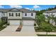 Charming townhome with a two-car garage and well-maintained landscaping at 2155 Cerulean Sky Dr, Lutz, FL 33558