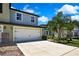 Two car garage and nicely landscaped front yard at 2155 Cerulean Sky Dr, Lutz, FL 33558