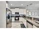 Bright kitchen with granite countertops, stainless steel appliances, white cabinets and tile floor at 2155 Cerulean Sky Dr, Lutz, FL 33558