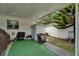 Backyard area with patio area, lawn mower and storage shed at 2334 14Th N Ave, St Petersburg, FL 33713