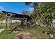 Landscaped backyard with a covered patio, ideal for gardening and relaxation at 2334 14Th N Ave, St Petersburg, FL 33713