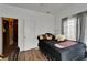 Simple bedroom with a bed, closet, and doorway to an adjacent room at 2334 14Th N Ave, St Petersburg, FL 33713