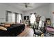 Cozy bedroom features wood floors, white walls, and a ceiling fan with great natural light at 2334 14Th N Ave, St Petersburg, FL 33713