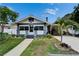 Charming single-story home with a well-kept lawn and a covered carport, complete with a lush, green yard at 2334 14Th N Ave, St Petersburg, FL 33713