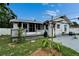 Charming single-story home featuring a screened porch and a well-maintained front yard at 2334 14Th N Ave, St Petersburg, FL 33713