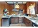 Well-equipped kitchen with wood paneling, granite countertops, and stainless-steel appliances at 2334 14Th N Ave, St Petersburg, FL 33713