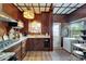 Cozy kitchen with wood paneling, granite countertops, and classic stained-glass pendant lighting at 2334 14Th N Ave, St Petersburg, FL 33713