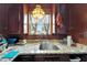 Kitchen sink with granite countertops, wood cabinets, and a bright window view at 2334 14Th N Ave, St Petersburg, FL 33713