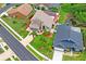 Stunning aerial shot of a well-maintained home with lush landscaping and a brick driveway at 277 Wood Dove Avenue, Tarpon Springs, FL 34689