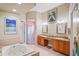 Bathroom with a jetted tub, a shower, and double sink vanity at 277 Wood Dove Avenue, Tarpon Springs, FL 34689