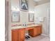 Bathroom showcasing a double vanity and an enclosed shower at 277 Wood Dove Avenue, Tarpon Springs, FL 34689