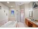 Bathroom featuring a jacuzzi tub, shower, and granite countertops at 277 Wood Dove Avenue, Tarpon Springs, FL 34689