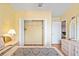 Bedroom closet with shelves and hangers, and light wood floors at 277 Wood Dove Avenue, Tarpon Springs, FL 34689