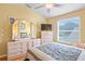 Light and bright bedroom featuring a large window and a ceiling fan at 277 Wood Dove Avenue, Tarpon Springs, FL 34689