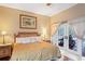 Bedroom with doors leading to a pool and patio area at 277 Wood Dove Avenue, Tarpon Springs, FL 34689