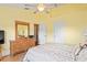 Primary bedroom featuring tropical decor and light yellow walls at 277 Wood Dove Avenue, Tarpon Springs, FL 34689