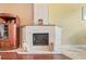 Close-up of a cozy fireplace with a mantle and hearth at 277 Wood Dove Avenue, Tarpon Springs, FL 34689