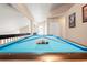 Upstairs game room with a pool table, blue felt, and lots of space to play at 277 Wood Dove Avenue, Tarpon Springs, FL 34689