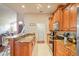Open kitchen features a stainless steel oven, granite counters, and wooden cabinets at 277 Wood Dove Avenue, Tarpon Springs, FL 34689