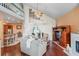 Spacious living room with a fireplace, high ceilings, and an open floor plan at 277 Wood Dove Avenue, Tarpon Springs, FL 34689