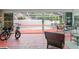 Enclosed pool area with two bikes, a table, and plenty of room for outdoor lounging at 277 Wood Dove Avenue, Tarpon Springs, FL 34689