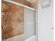 This tile shower includes sliding glass door entry at 277 Wood Dove Avenue, Tarpon Springs, FL 34689