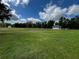 Expansive, well-maintained backyard featuring a gazebo, perfect for outdoor activities and relaxation at 2772 Golf Lake Dr # 03, Plant City, FL 33566