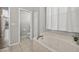 Bright bathroom features a marble soaking tub with views of the neighborhood at 2772 Golf Lake Dr # 03, Plant City, FL 33566