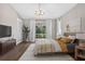 Cozy bedroom with hardwood floors, natural light, and contemporary furniture at 2772 Golf Lake Dr # 03, Plant City, FL 33566