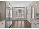 Bright breakfast nook features a bay window, hardwood floors, and stainless steel appliances in the kitchen at 2772 Golf Lake Dr # 03, Plant City, FL 33566