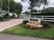 Inviting community entrance with stone signage and manicured landscaping, adding to the neighborhood's charm at 2772 Golf Lake Dr # 03, Plant City, FL 33566