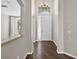 Inviting foyer with dark wood floors, high ceilings, and a chandelier light fixture at 2772 Golf Lake Dr # 03, Plant City, FL 33566
