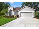 Charming single-story home with a two-car garage, manicured landscaping, and a tile roof at 2772 Golf Lake Dr # 03, Plant City, FL 33566