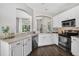 A kitchen featuring stainless steel appliances, light quartz countertops, and dark wood flooring at 2772 Golf Lake Dr # 03, Plant City, FL 33566