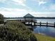 Scenic lake view with a charming gazebo extending over the water, perfect for peaceful contemplation at 2772 Golf Lake Dr # 03, Plant City, FL 33566
