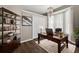 A stylish home office with a large desk, shelving, and natural light at 2772 Golf Lake Dr # 03, Plant City, FL 33566