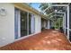 Enjoy the outdoors on this screened patio with beautiful brick pavers and a cozy stone fire pit at 2772 Golf Lake Dr # 03, Plant City, FL 33566