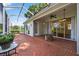 Relax on the screened patio with brick pavers and a charming stone fire pit, perfect for outdoor enjoyment at 2772 Golf Lake Dr # 03, Plant City, FL 33566