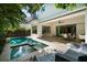 Beautiful pool and spa area with an adjacent covered patio, perfect for entertaining and relaxation at 2803 W Aquilla St, Tampa, FL 33629