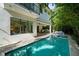 Expansive backyard with a sparkling pool, spa, and a covered outdoor living area at 2803 W Aquilla St, Tampa, FL 33629