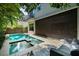 Stunning pool and spa with covered patio; retractable screen drawn at 2803 W Aquilla St, Tampa, FL 33629