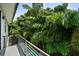 Balcony with metal railing and lush tropical views at 2803 W Aquilla St, Tampa, FL 33629