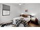Bedroom featuring a ceiling fan, gray window shades, and a cozy bed with decorative pillows and blankets at 2803 W Aquilla St, Tampa, FL 33629