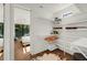 Bright walk-in closet with white shelving and hardwood floors, leading to a bedroom at 2803 W Aquilla St, Tampa, FL 33629