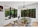 Bright dining room showcasing views of the pool, complemented by a glass table at 2803 W Aquilla St, Tampa, FL 33629